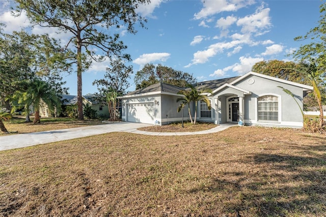 ranch-style home with a front yard and a garage