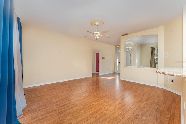 spare room with ceiling fan and light hardwood / wood-style floors