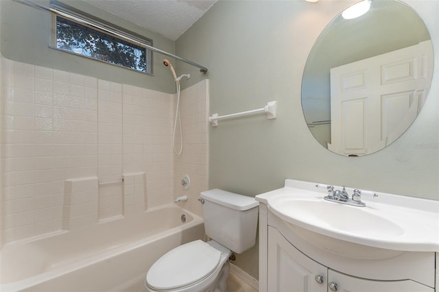 full bathroom with toilet, a textured ceiling, tub / shower combination, and vanity