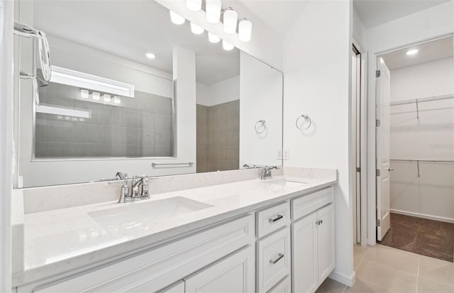 bathroom with tile patterned floors and vanity