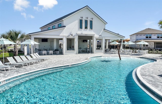 view of swimming pool with a patio area