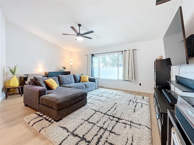 living room with ceiling fan and light hardwood / wood-style floors