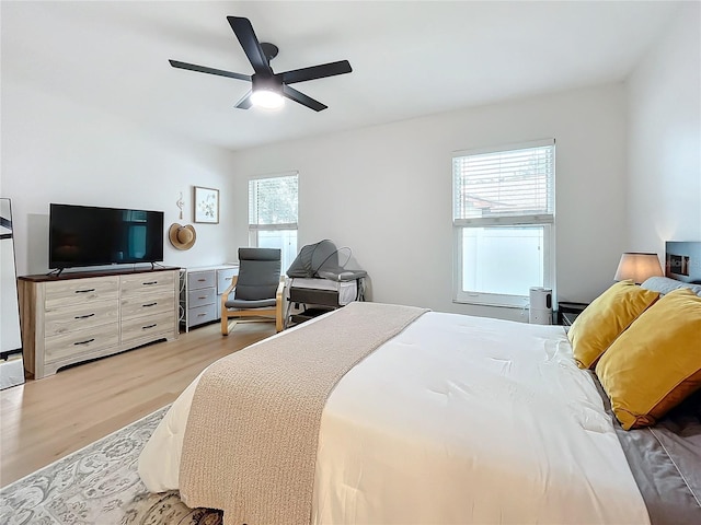 bedroom featuring ceiling fan and light hardwood / wood-style floors