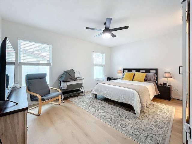 bedroom featuring ceiling fan and light wood-type flooring