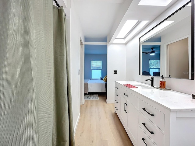 bathroom featuring vanity and hardwood / wood-style flooring