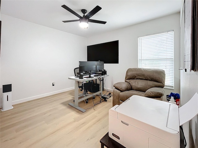 office with ceiling fan, a healthy amount of sunlight, and light hardwood / wood-style flooring