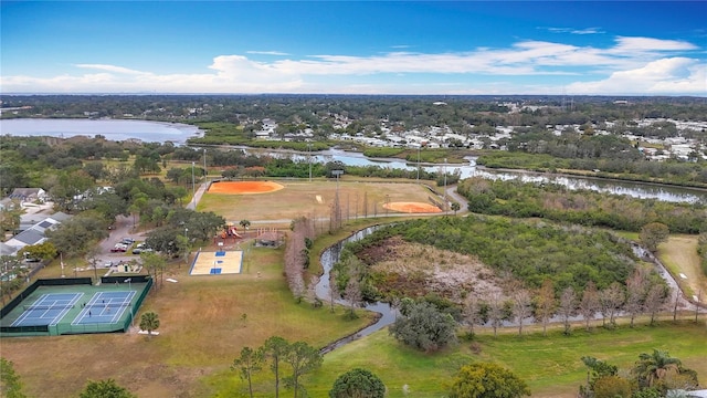 birds eye view of property with a water view