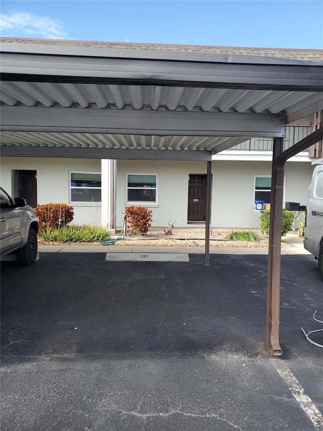 view of vehicle parking featuring a carport