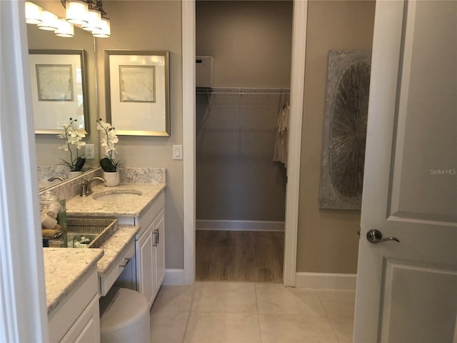 bathroom featuring vanity and tile patterned flooring