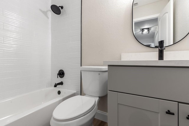 full bathroom featuring toilet, shower / bathing tub combination, and vanity