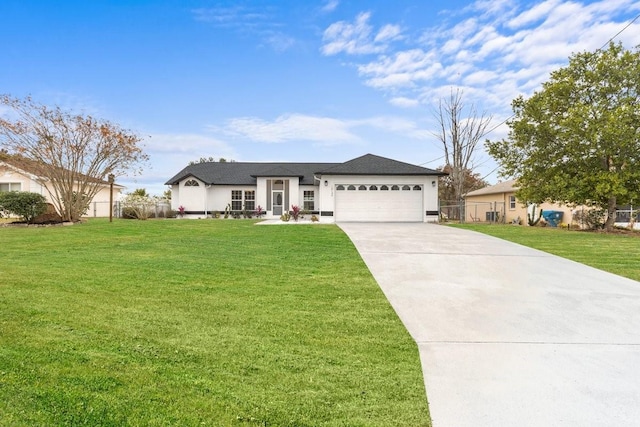 single story home featuring a front lawn and a garage