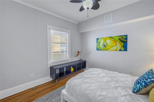 bedroom with hardwood / wood-style floors and ceiling fan