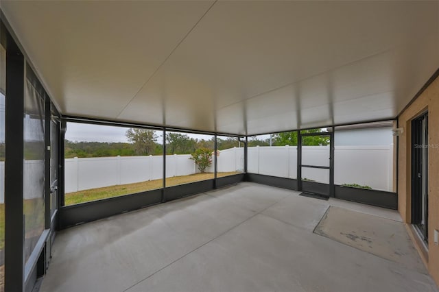 unfurnished sunroom featuring a wealth of natural light