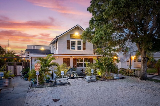 view of back house at dusk