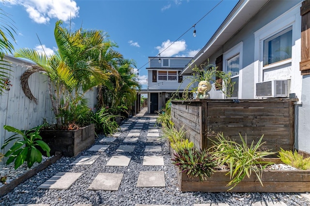 view of front of home with cooling unit