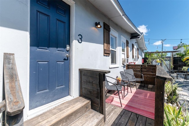 doorway to property featuring a deck