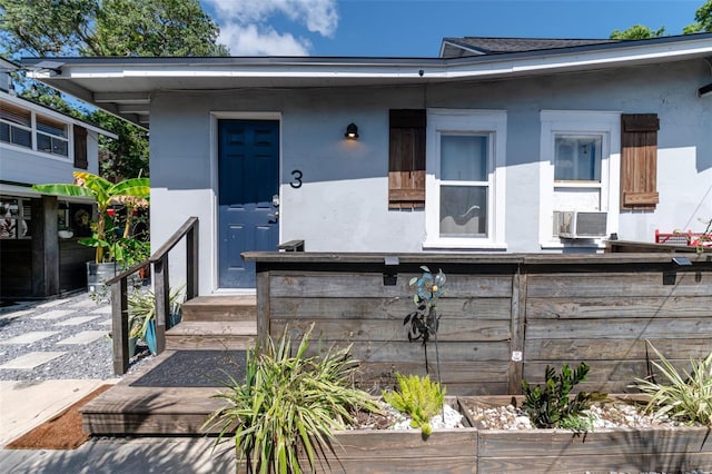 view of front of home with cooling unit