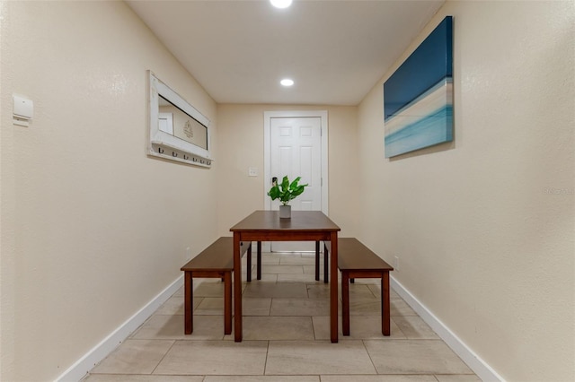 corridor with light tile patterned floors