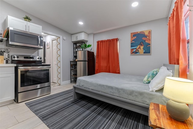 tiled bedroom featuring stainless steel refrigerator