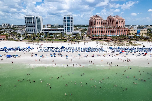 birds eye view of property with a view of the beach and a water view