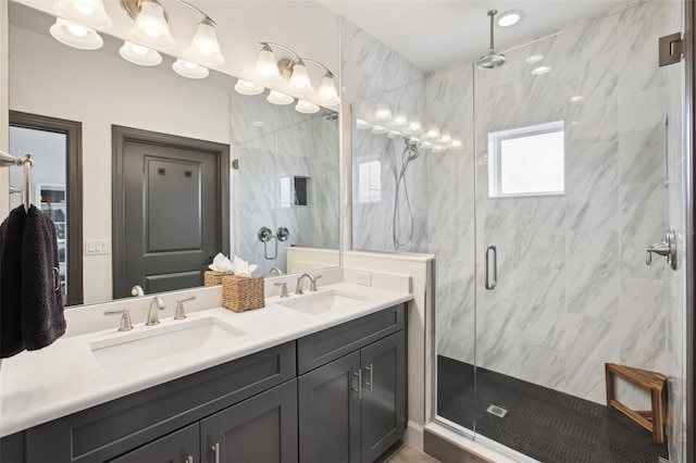 bathroom featuring walk in shower and vanity