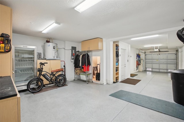 garage featuring water heater, a garage door opener, and electric panel