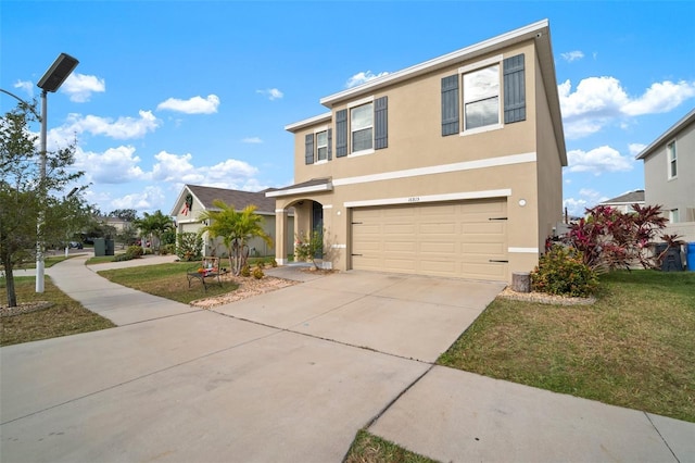 view of front of home with a garage and a front lawn