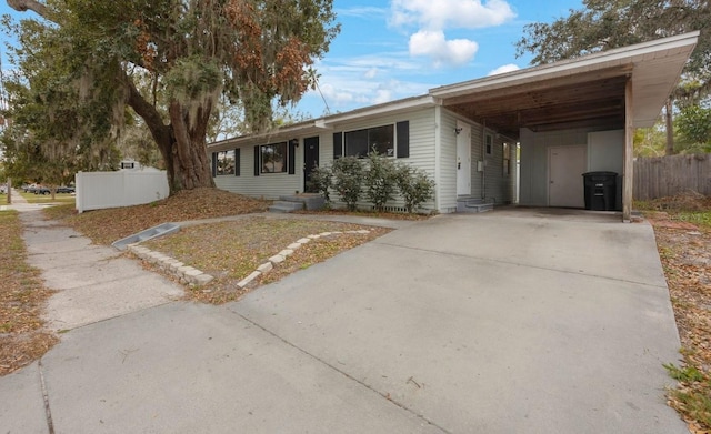 ranch-style home with a carport