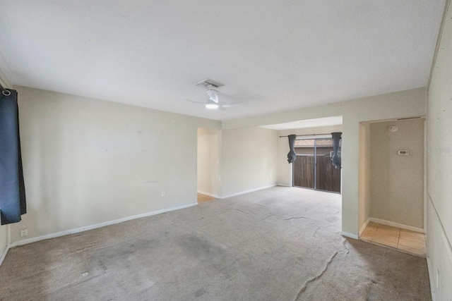 unfurnished room with carpet floors and ceiling fan