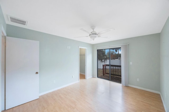 spare room featuring ceiling fan and light hardwood / wood-style floors