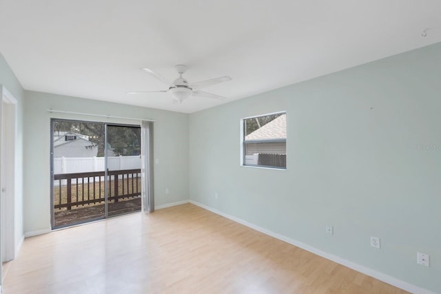 spare room featuring light wood-type flooring and ceiling fan