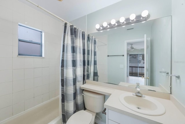 full bathroom featuring toilet, vanity, and shower / tub combo