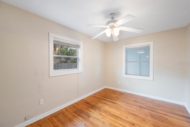 unfurnished room with ceiling fan and light hardwood / wood-style flooring