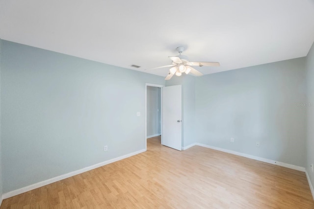 spare room featuring ceiling fan and light hardwood / wood-style floors