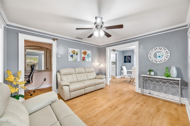 living room with ceiling fan, ornamental molding, and wood-type flooring