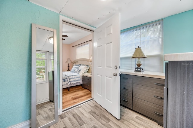 interior space featuring light wood-type flooring and ceiling fan