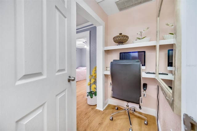 office space featuring hardwood / wood-style flooring and ceiling fan