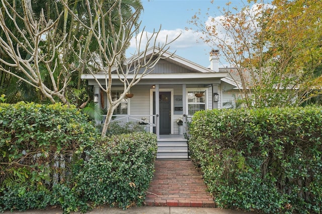 bungalow-style house featuring covered porch