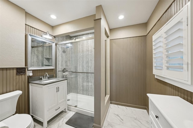 bathroom featuring toilet, vanity, an enclosed shower, and wooden walls