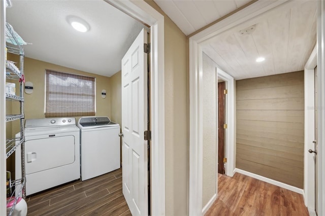 washroom featuring dark hardwood / wood-style flooring and separate washer and dryer