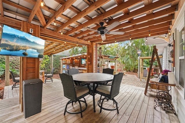 wooden terrace featuring ceiling fan