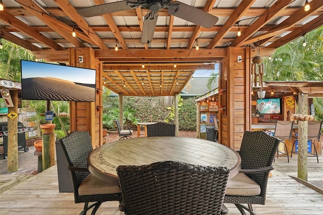 wooden deck featuring ceiling fan