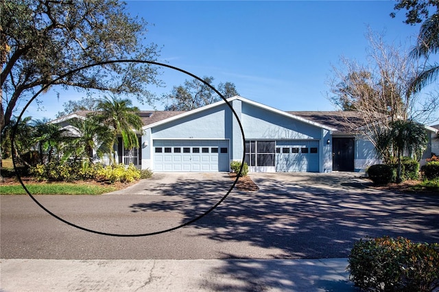 single story home with a garage