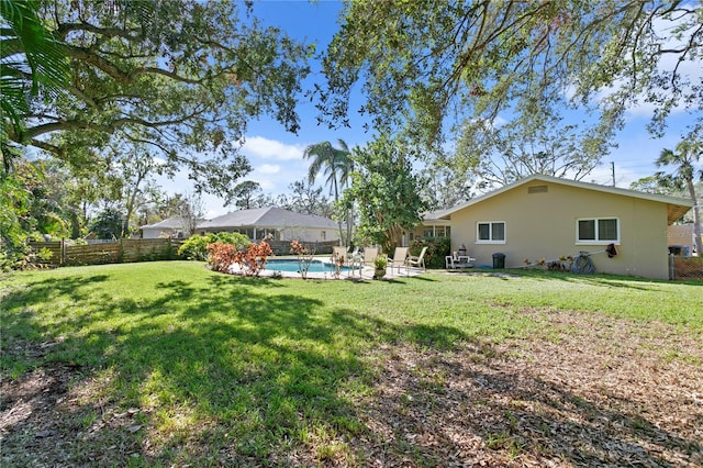 view of yard featuring a fenced in pool