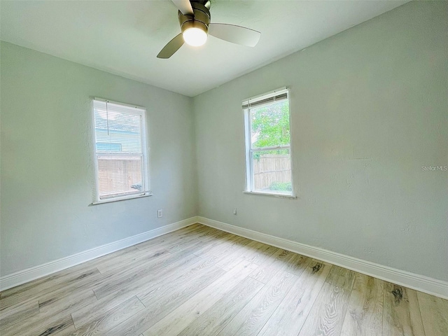 unfurnished room with light hardwood / wood-style floors and ceiling fan