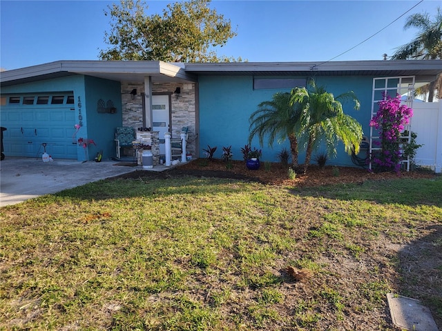 ranch-style home with a garage and a front yard