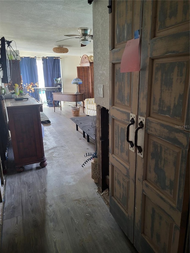 interior space with hardwood / wood-style floors and a textured ceiling