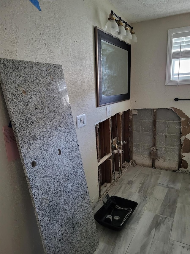 bathroom featuring a textured ceiling