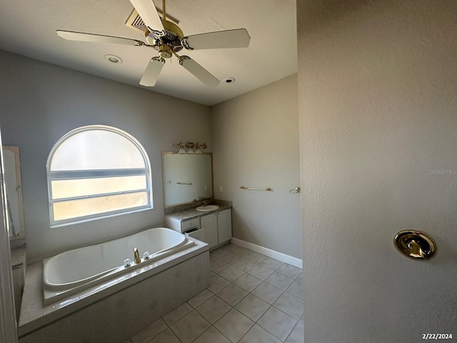 bathroom with ceiling fan, tile patterned floors, vanity, and a bathing tub