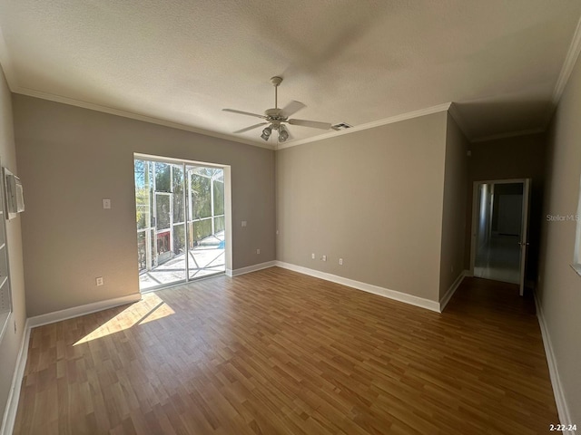 unfurnished room with ceiling fan, wood-type flooring, ornamental molding, and a textured ceiling